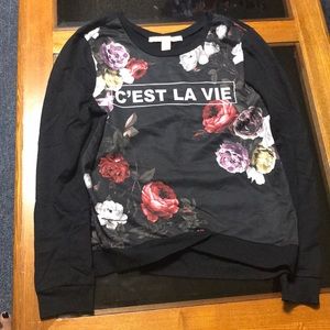 Sweater that says “C’EST LA VIE” with roses